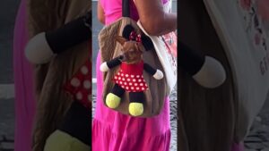 Person Carries Dog in Adorable Cartoon-Themed Backpack